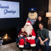 Baby on Santa's lap with parents